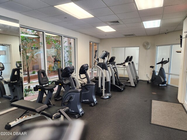 gym featuring a paneled ceiling