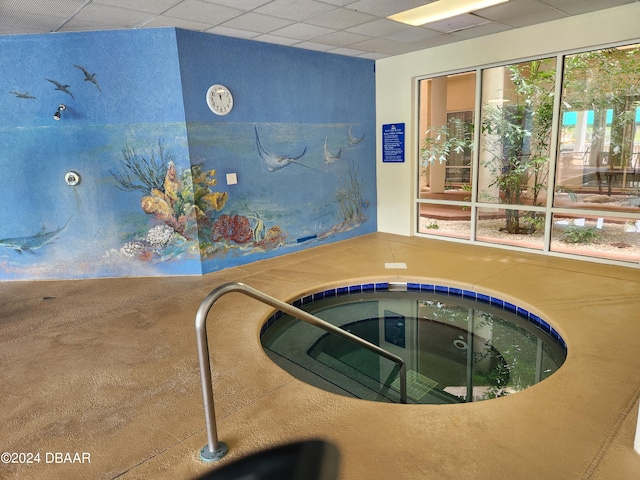 view of swimming pool with an indoor in ground hot tub