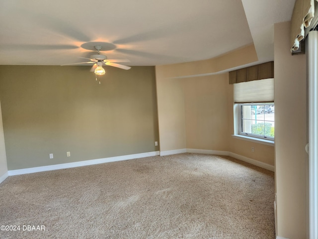 carpeted empty room with ceiling fan