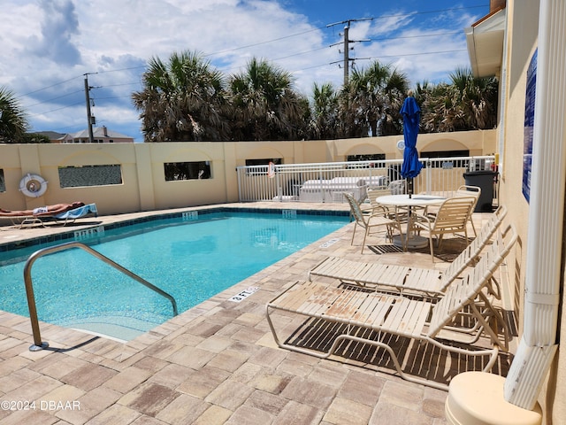 view of swimming pool featuring a patio