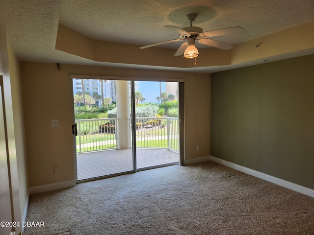 4670 Links Village Dr Unit D204, Ponce Inlet, FL 32127 - empty room featuring a textured ceiling, ceiling fan, carpet, and baseboards