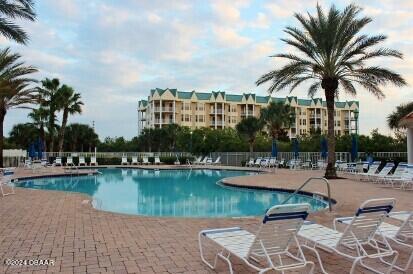 view of pool featuring a patio area