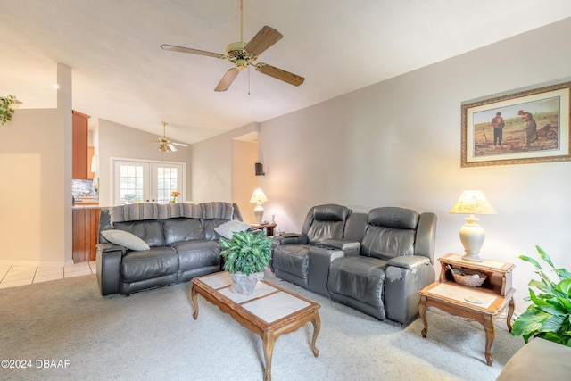 carpeted living room with ceiling fan, french doors, and lofted ceiling