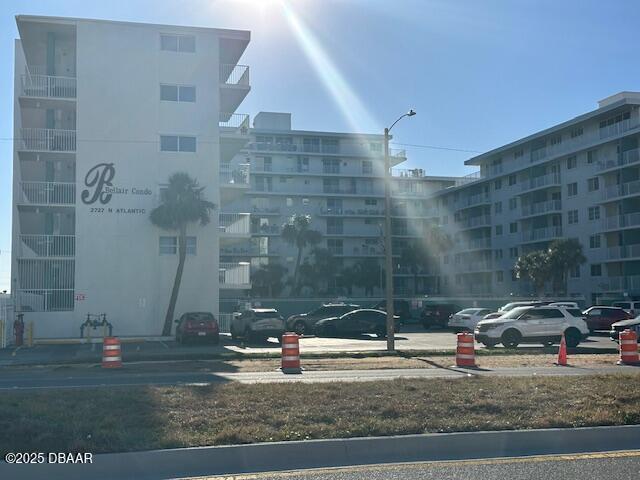 view of property with uncovered parking