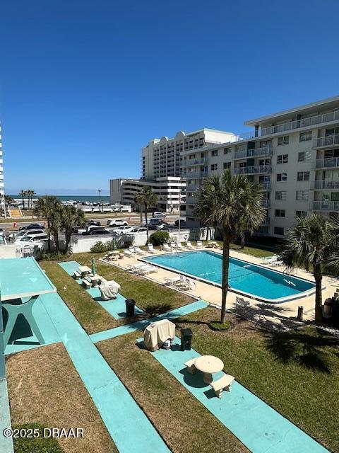 community pool with a city view