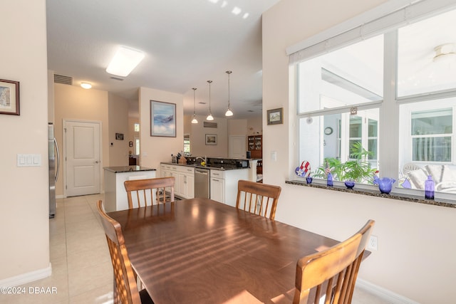 dining area featuring light tile patterned flooring