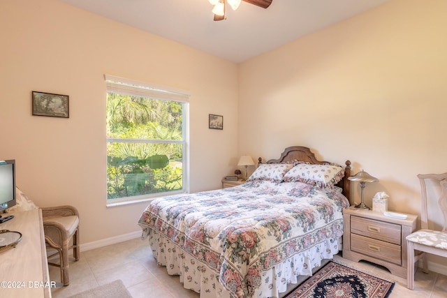 tiled bedroom with ceiling fan