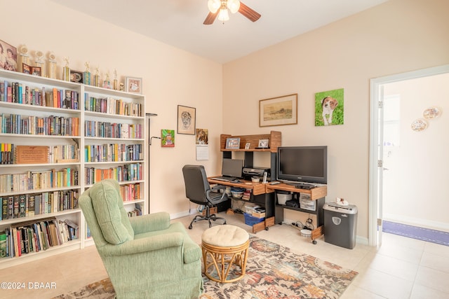 tiled home office featuring ceiling fan