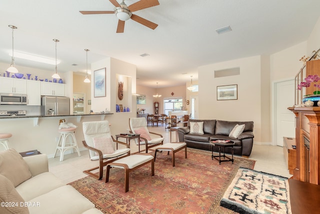 living room with light tile patterned flooring and ceiling fan