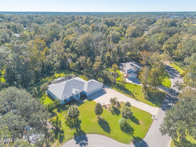 view of front of home with a garage and a front lawn