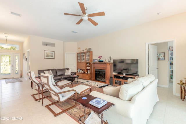 tiled living room with ceiling fan