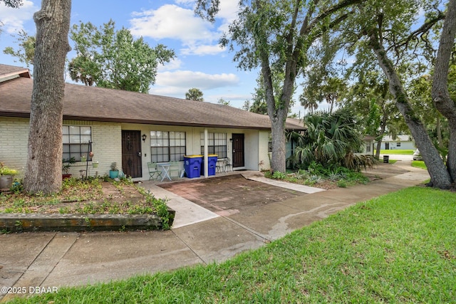 ranch-style house with a front lawn