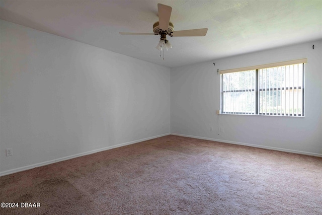 unfurnished room featuring carpet floors and ceiling fan