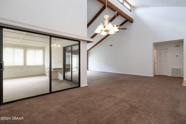 unfurnished room with a chandelier, beam ceiling, high vaulted ceiling, and carpet