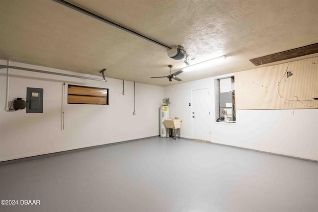 garage featuring electric panel, heating unit, a garage door opener, electric water heater, and ceiling fan