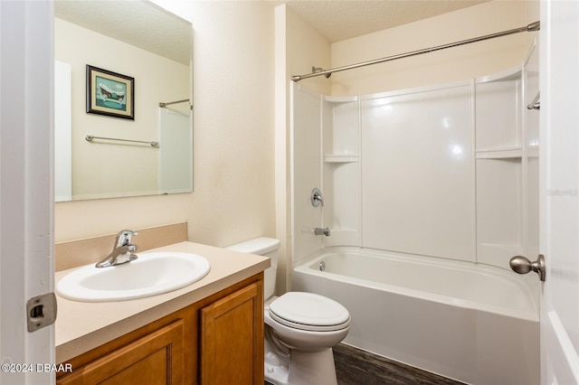 full bathroom featuring wood-type flooring, toilet, a textured ceiling, vanity, and shower / tub combination