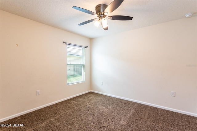 carpeted empty room with a textured ceiling and ceiling fan