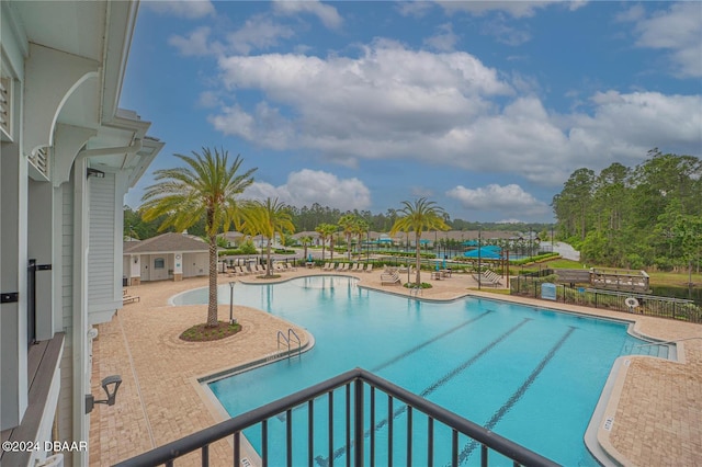 view of swimming pool with a patio