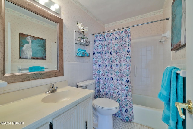 full bathroom with vanity, shower / bath combo, tile walls, and toilet