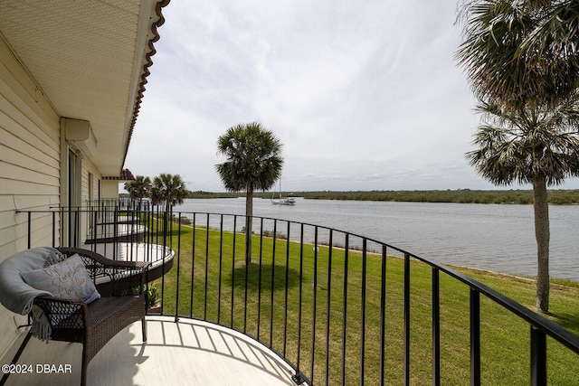 balcony featuring a water view