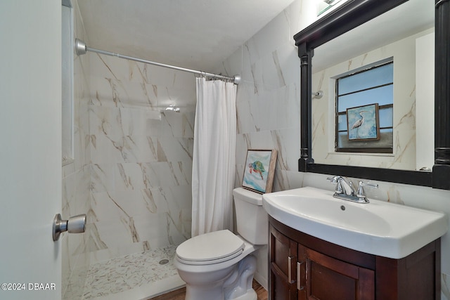 bathroom with tile walls, walk in shower, vanity, hardwood / wood-style flooring, and toilet