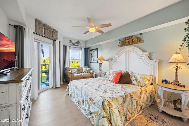 bedroom with access to outside, light hardwood / wood-style floors, and ceiling fan