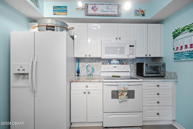 kitchen featuring white cabinets, white appliances, and backsplash