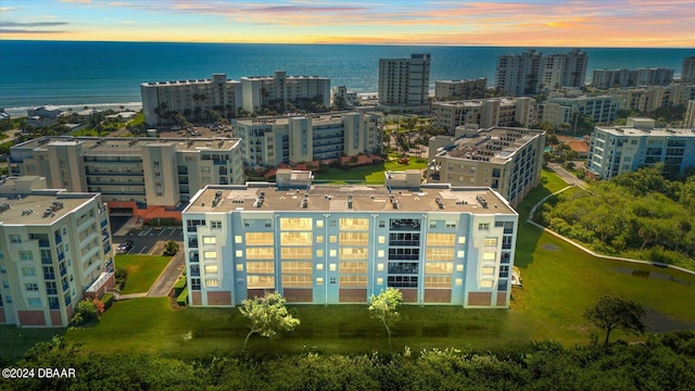 aerial view at dusk with a water view