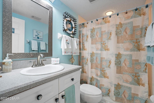 bathroom featuring vanity, a textured ceiling, toilet, and a shower with shower curtain