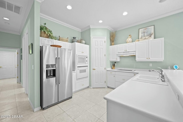 kitchen featuring sink, white cabinets, white appliances, and ornamental molding