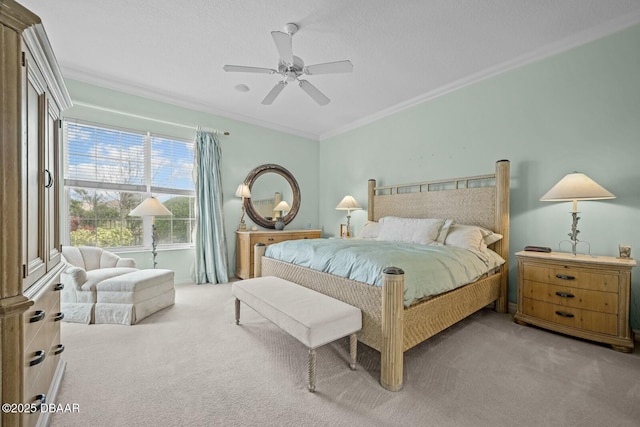 carpeted bedroom with ceiling fan, ornamental molding, and a textured ceiling