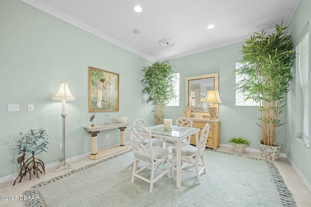 dining area featuring light tile patterned floors and ornamental molding