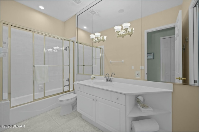 full bathroom featuring vanity, combined bath / shower with glass door, tile patterned flooring, toilet, and a notable chandelier