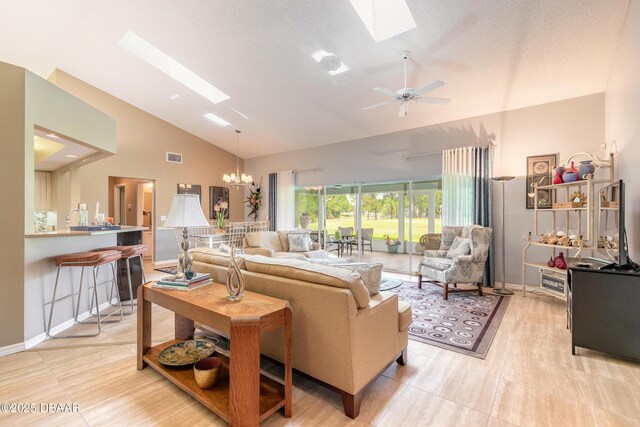 6273 Paradise Island Ct, Port Orange, FL 32128 - living area featuring a skylight, high vaulted ceiling, a chandelier, baseboards, and a ceiling fan