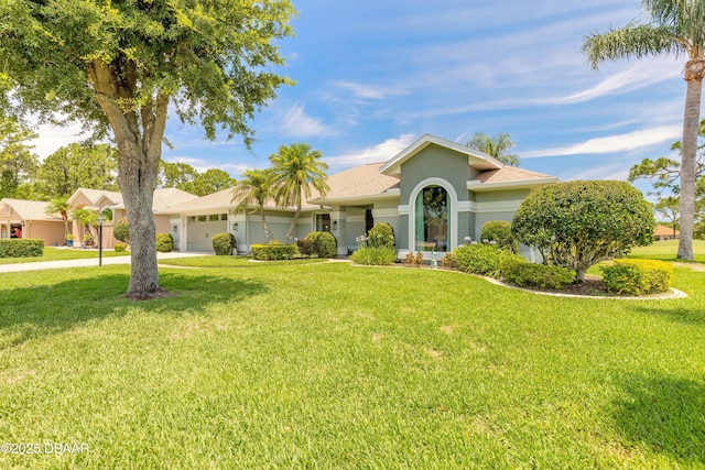 6273 Paradise Island Ct, Port Orange, FL 32128 - view of front facade featuring a garage, stucco siding, a front yard, and concrete driveway