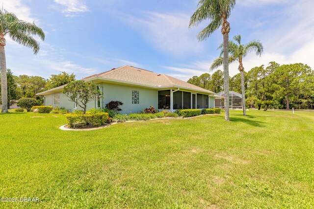 6273 Paradise Island Ct, Port Orange, FL 32128 - back of house with stucco siding and a yard