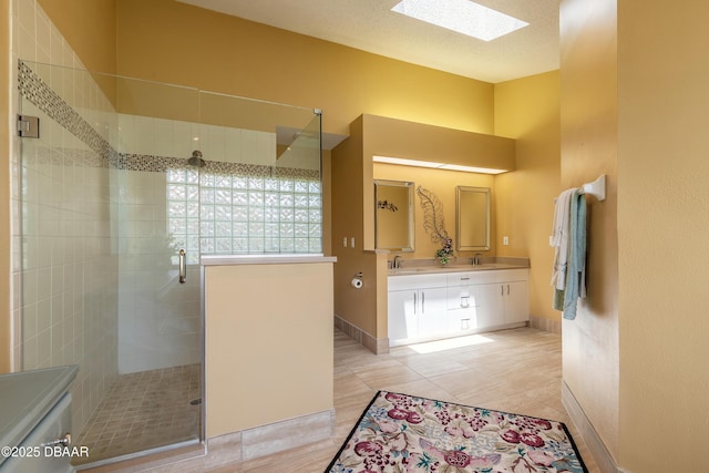 6273 Paradise Island Ct, Port Orange, FL 32128 - full bathroom with a skylight, a stall shower, double vanity, tile patterned floors, and baseboards