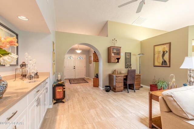 6273 Paradise Island Ct, Port Orange, FL 32128 - entrance foyer featuring arched walkways, a ceiling fan, baseboards, and lofted ceiling