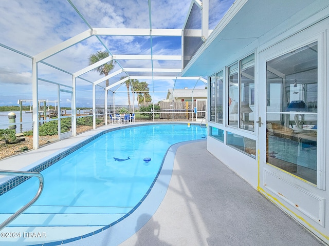 view of swimming pool with a lanai