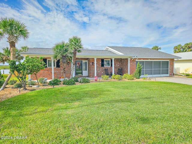 single story home featuring a front yard and a garage