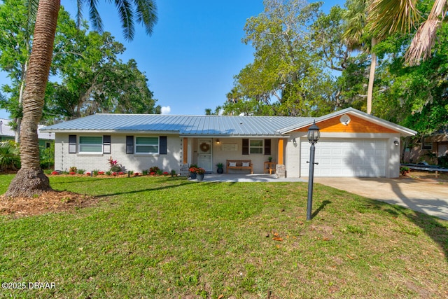 22 Cedar St, Port Orange, FL 32127 - ranch-style home featuring an attached garage, driveway, a front yard, metal roof, and brick siding