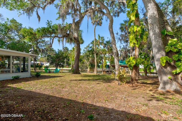 22 Cedar St, Port Orange, FL 32127 - view of yard with a sunroom