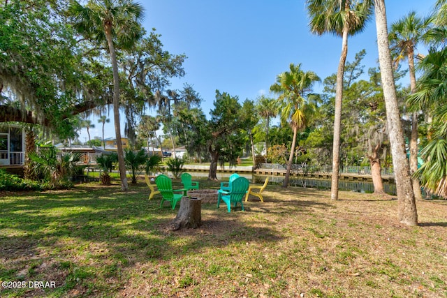 22 Cedar St, Port Orange, FL 32127 - view of grassy yard featuring an outdoor fire pit