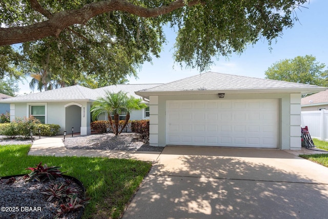 5479 Saint Regis Way, Port Orange, FL 32128 - ranch-style home with stucco siding, driveway, and an attached garage