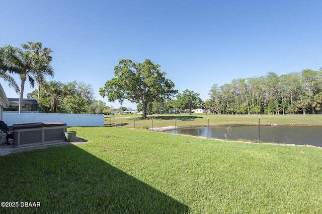 5479 Saint Regis Way, Port Orange, FL 32128 - fenced yard featuring a hot tub and a water view