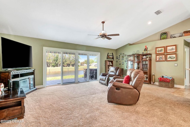 5479 Saint Regis Way, Port Orange, FL 32128 - carpeted living area with a ceiling fan, lofted ceiling, and a water view