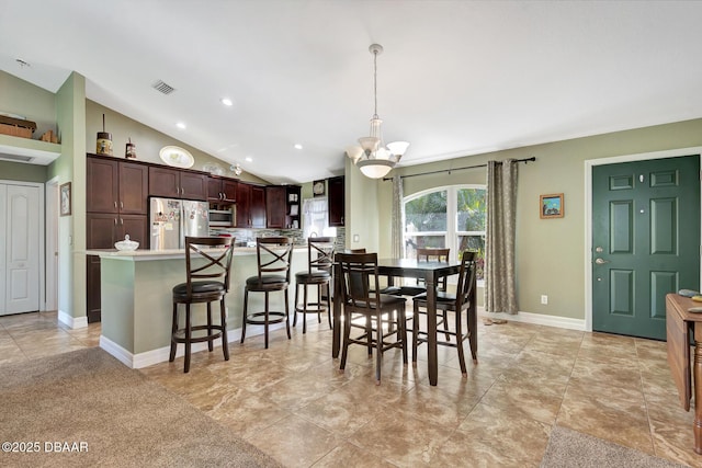5479 Saint Regis Way, Port Orange, FL 32128 - dining space featuring vaulted ceiling, recessed lighting, and a chandelier
