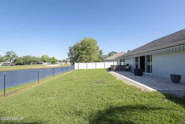 5479 Saint Regis Way, Port Orange, FL 32128 - fenced backyard featuring a hot tub, a water view, and a patio area