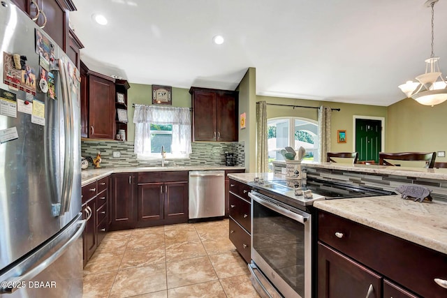 5479 Saint Regis Way, Port Orange, FL 32128 - kitchen with stainless steel appliances, decorative backsplash, hanging light fixtures, recessed lighting, and dark brown cabinetry