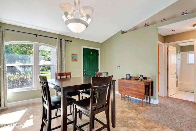 5479 Saint Regis Way, Port Orange, FL 32128 - dining area featuring plenty of natural light, a chandelier, and vaulted ceiling